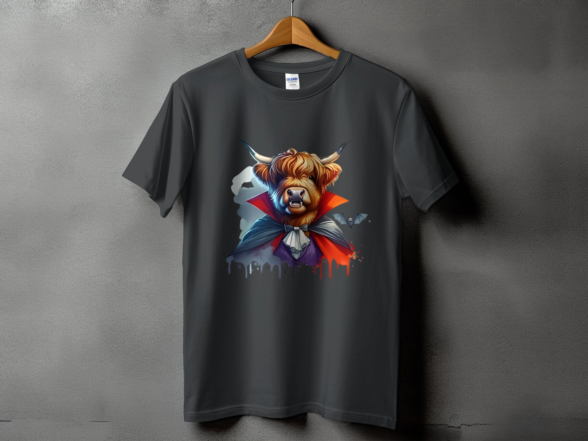 Dark grey t-shirt with a Highland cow dressed as a vampire with bats.