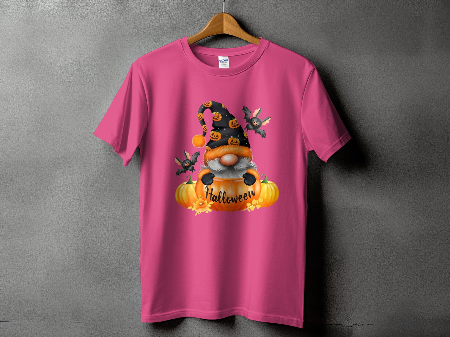 Pink t-shirt with a Halloween gnome graphic and text.