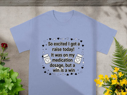 Light blue t-shirt with "So excited I got a raise today!" text design.