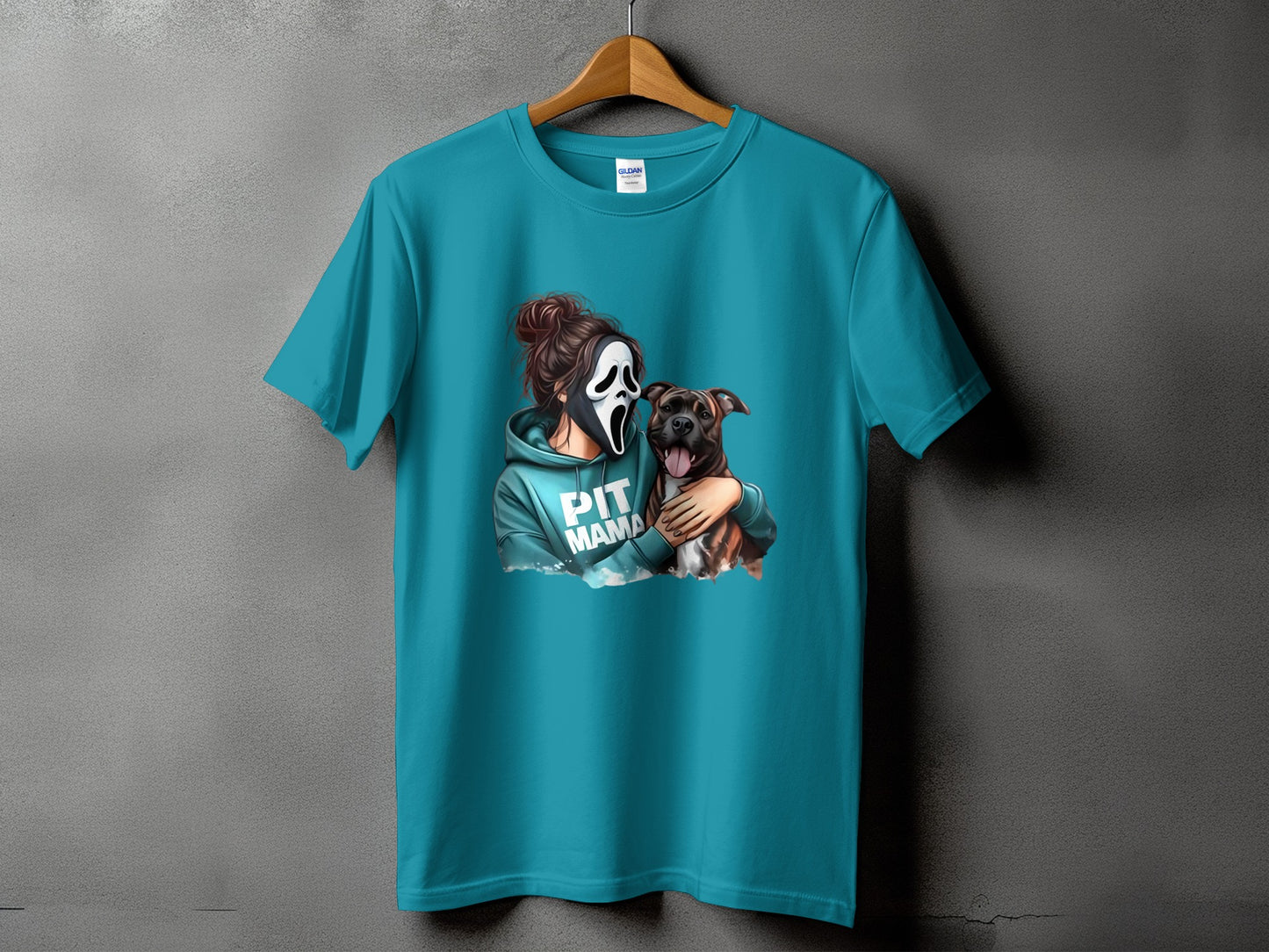 Teal t-shirt with graphic of a person in a scream mask holding a pitbull, text "PIT MAMA".