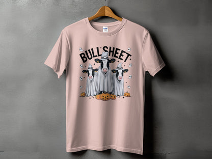 Pink t-shirt with three cows in ghost costumes and pumpkins.