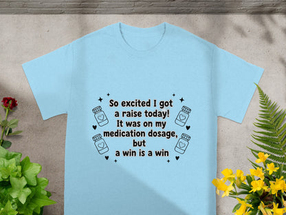 Light blue t-shirt with "So excited I got a raise today!" text.