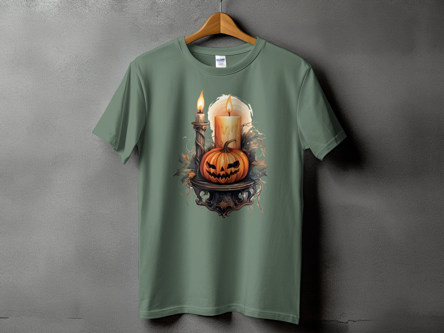 Halloween t-shirt with carved pumpkin, candles, and decorative foliage.