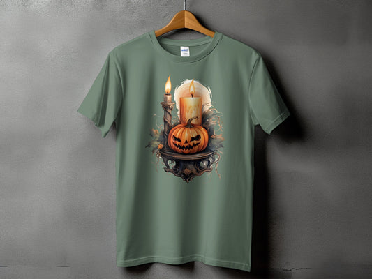 Halloween t-shirt with carved pumpkin, candles, and decorative foliage.