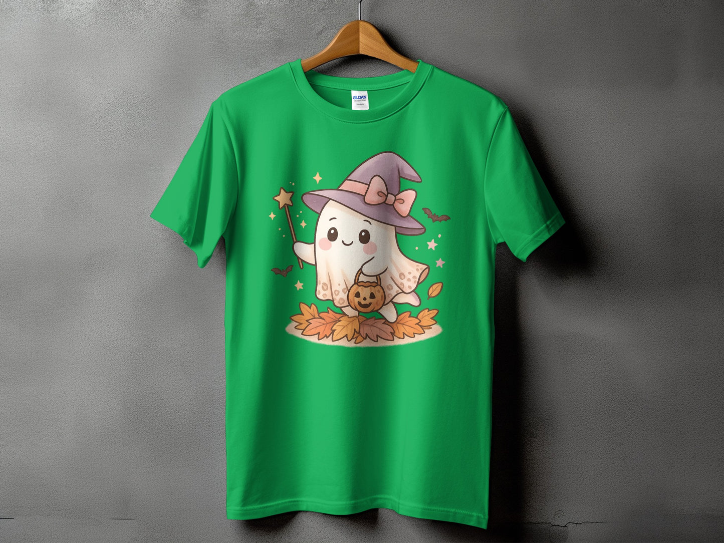 Green t-shirt with a kawaii ghost wearing a witch hat holding a candy bucket.
