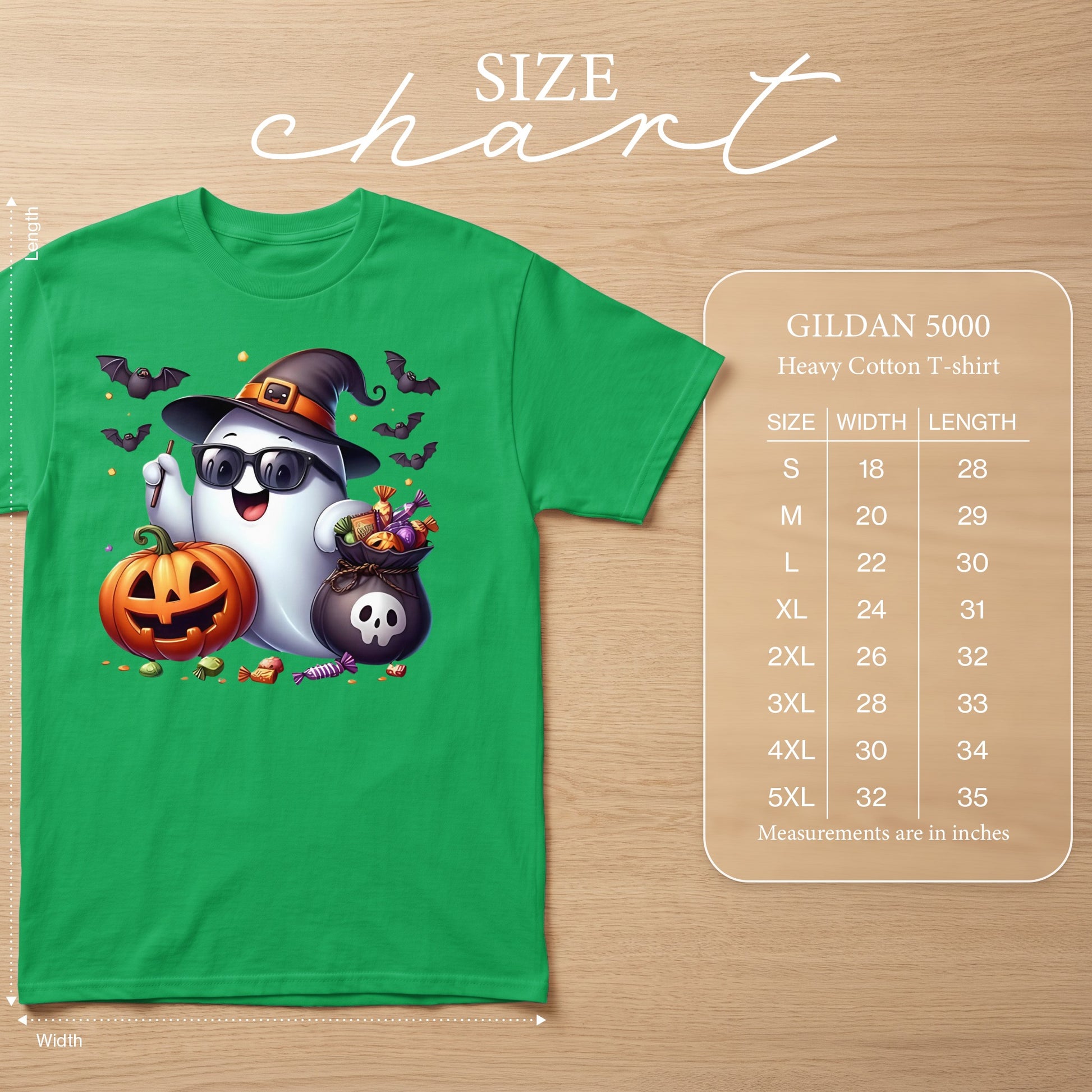 Green t-shirt with cartoon ghost, pumpkin, candy, and bats. Size chart included.