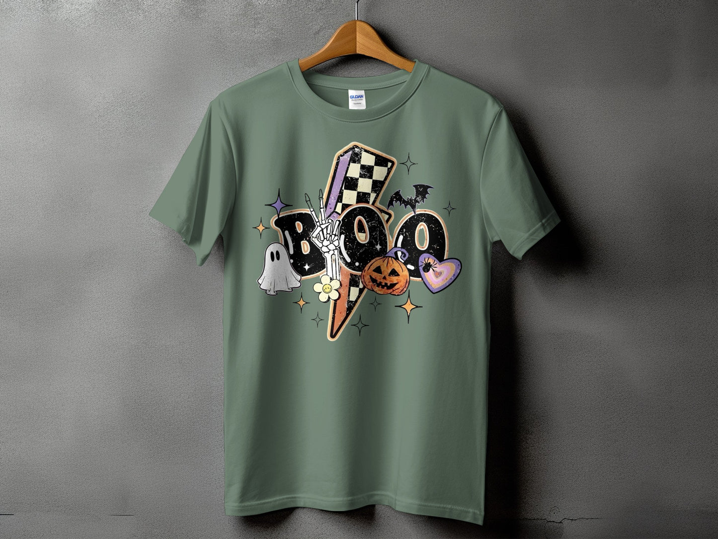 Green t-shirt with "Boo" graphic featuring Halloween elements and a skeleton hand.