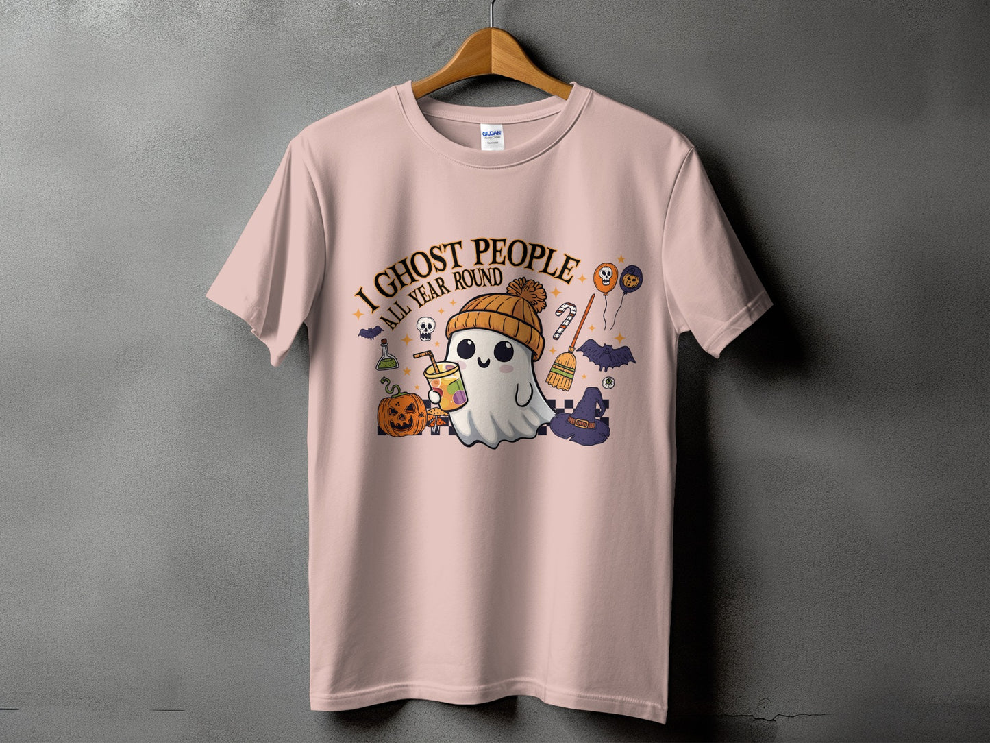 Pink t-shirt with a kawaii ghost graphic saying "I Ghost People All Year Round."