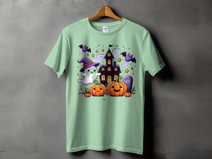 Light green t-shirt with a Halloween-themed graphic of a ghost, pumpkins, and a haunted house.