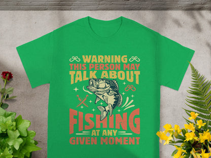 Green t-shirt with "Warning This Person May Talk About Fishing At Any Given Moment" graphic.