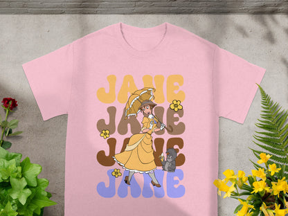 Pink t-shirt with retro "Jane" graphic featuring a woman with umbrella and monkey.