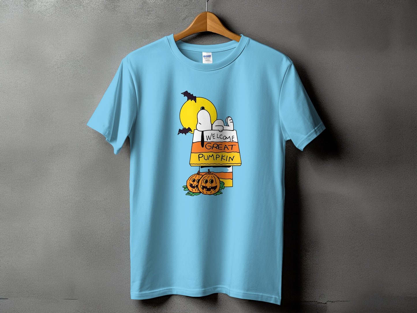 Light blue t-shirt with Snoopy and "Welcome Great Pumpkin" Halloween graphic.