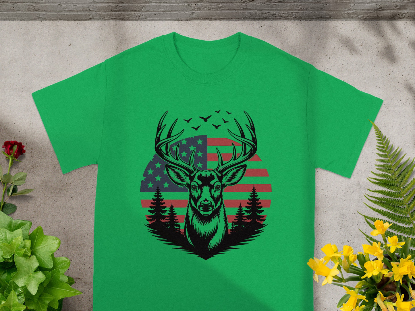 Green t-shirt with deer, trees, American flag, and birds graphic.
