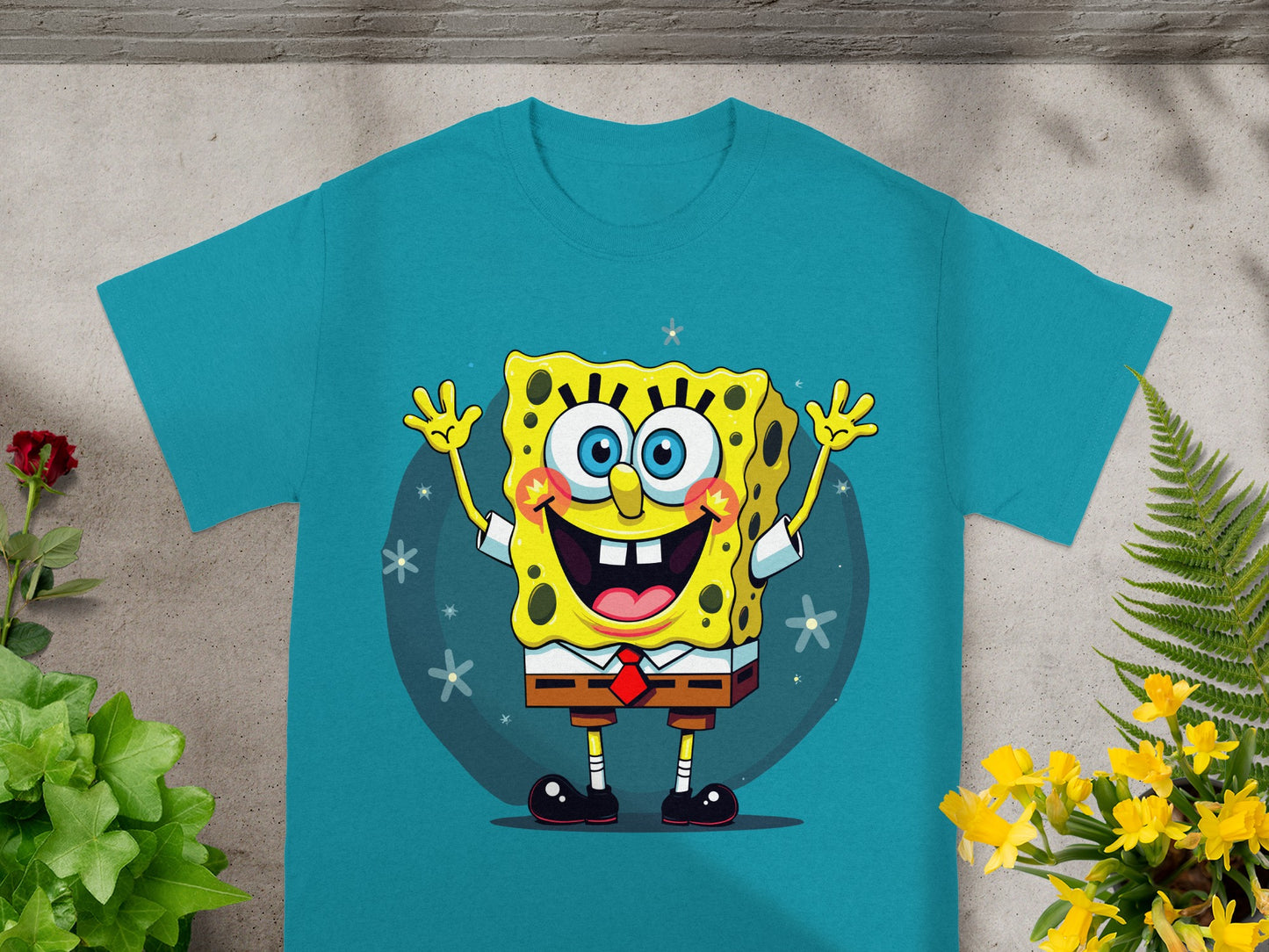 SpongeBob SquarePants graphic on a teal t-shirt.