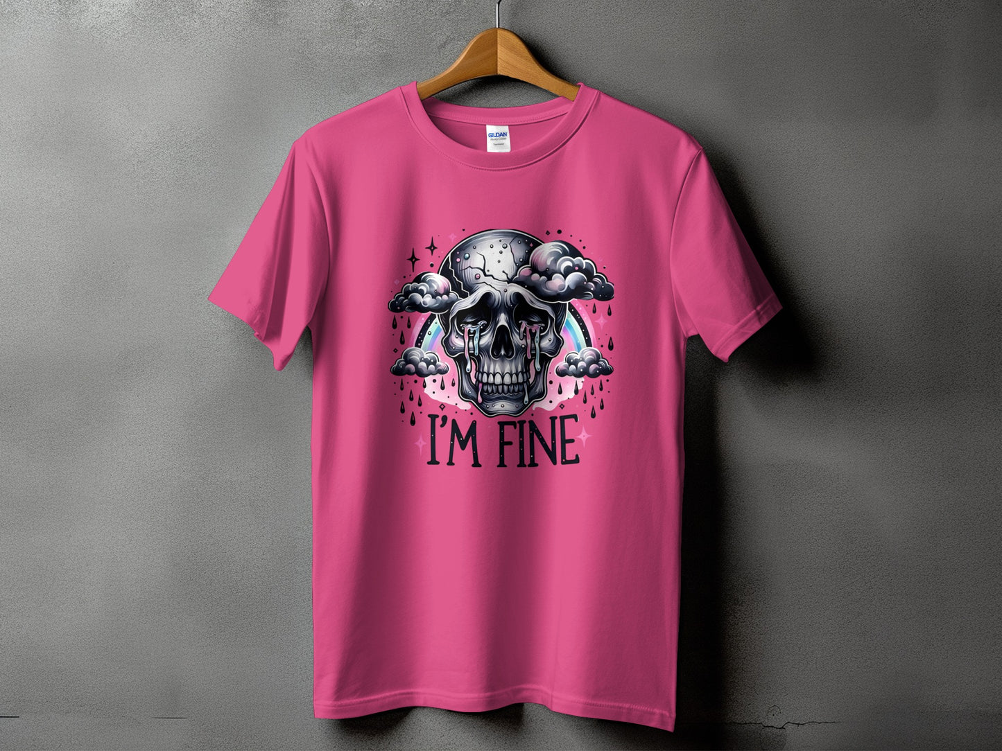 Pink t-shirt with a crying skull graphic and the text "I'M FINE".
