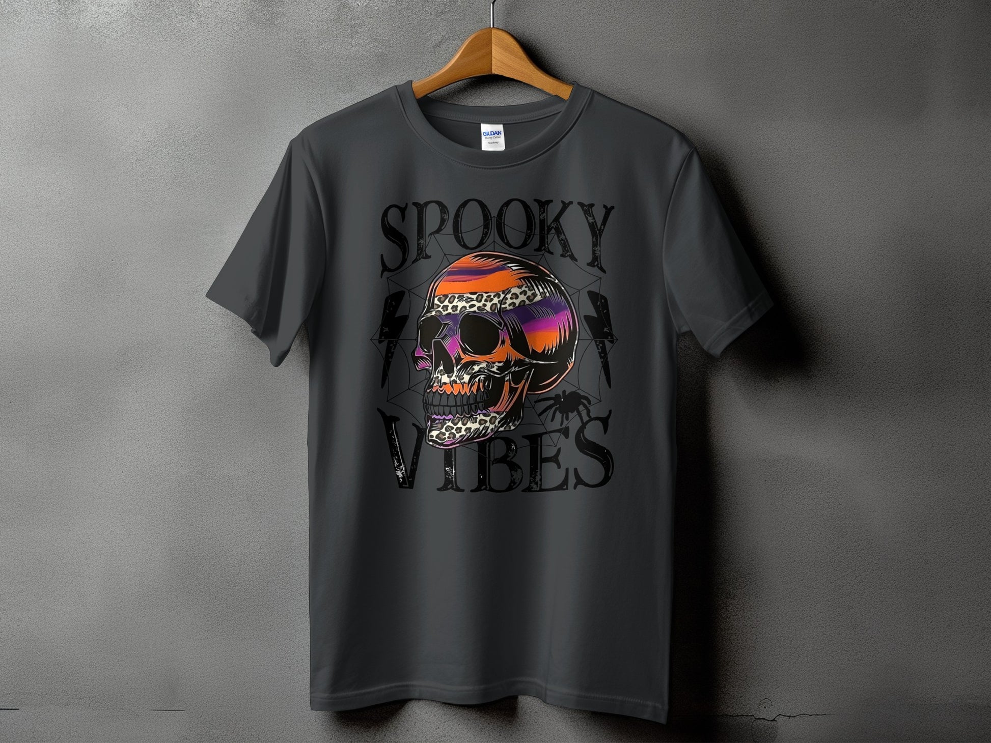 Dark gray t-shirt with "Spooky Vibes" text and a colorful, patterned skull graphic.