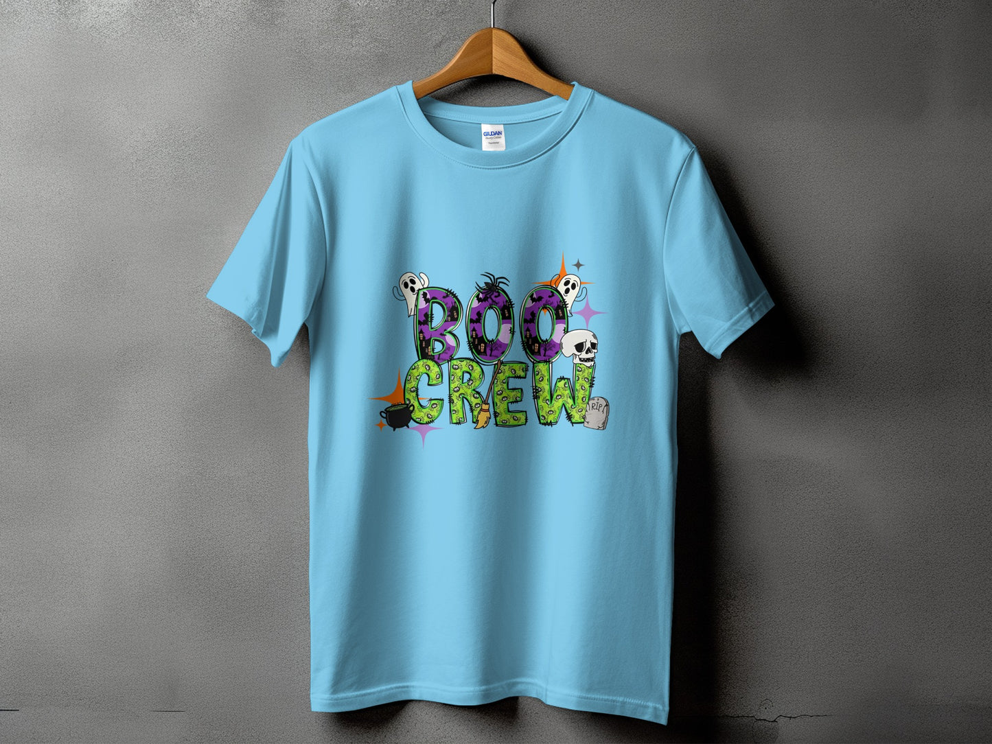 Light blue t-shirt with "Boo Crew" text featuring ghosts, skull, and Halloween graphics.