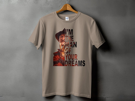 Freddy Krueger graphic with "I'M THE MAN OF YOUR DREAMS" text on a tan t-shirt.