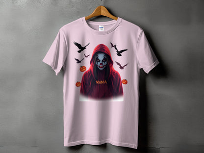 Pink t-shirt with a spooky clown design, text "MAMA", and surrounding crows and pumpkins.