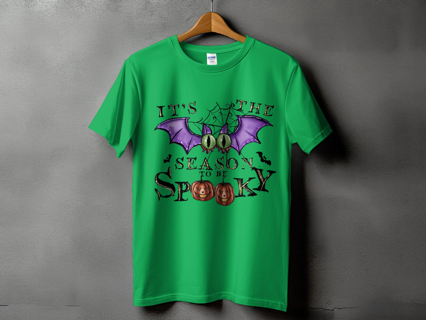 Green t-shirt with Halloween graphic: "It's the season to be spooky"