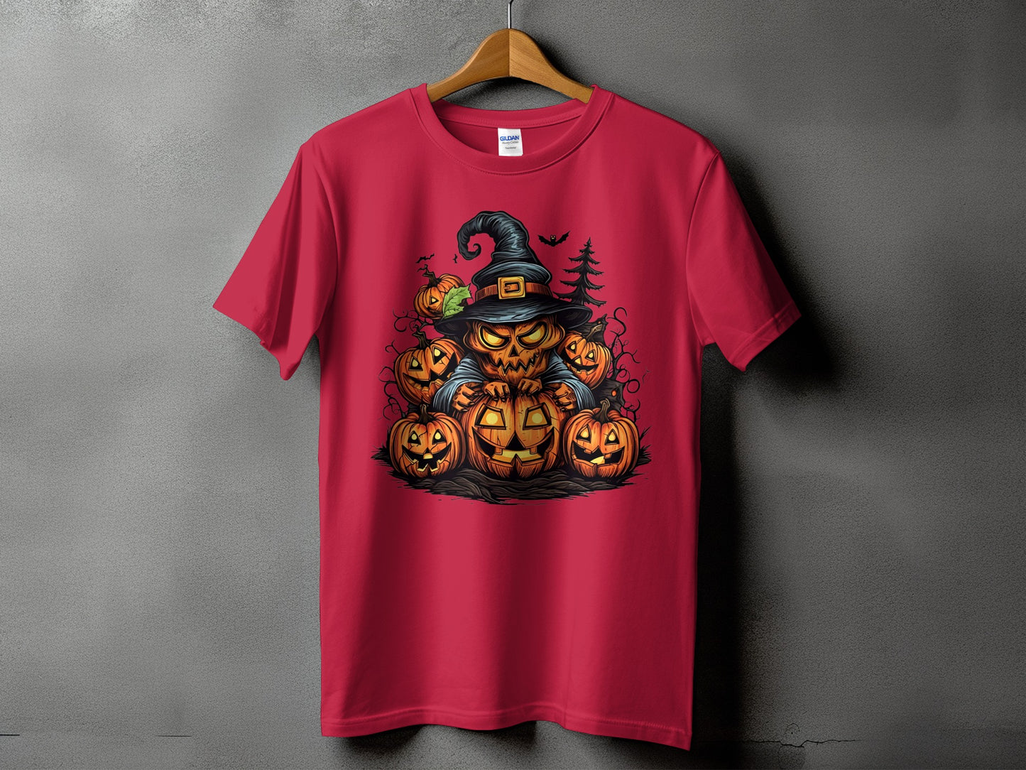 Red t-shirt featuring a spooky jack-o'-lantern character wearing a witch hat surrounded by pumpkins.
