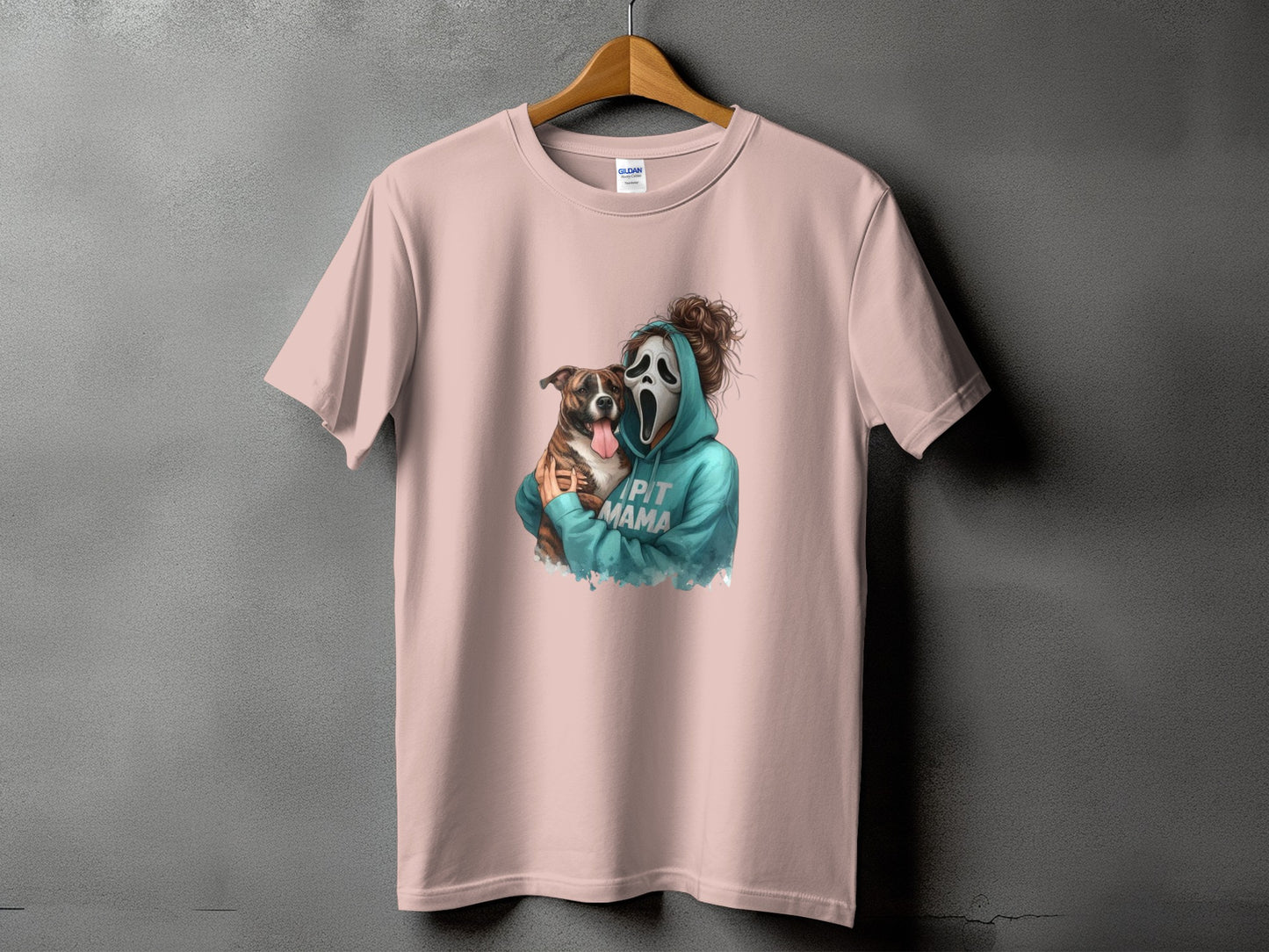 Pink t-shirt with a graphic of a person in a Scream mask hugging a dog, text says "Pit Mama".