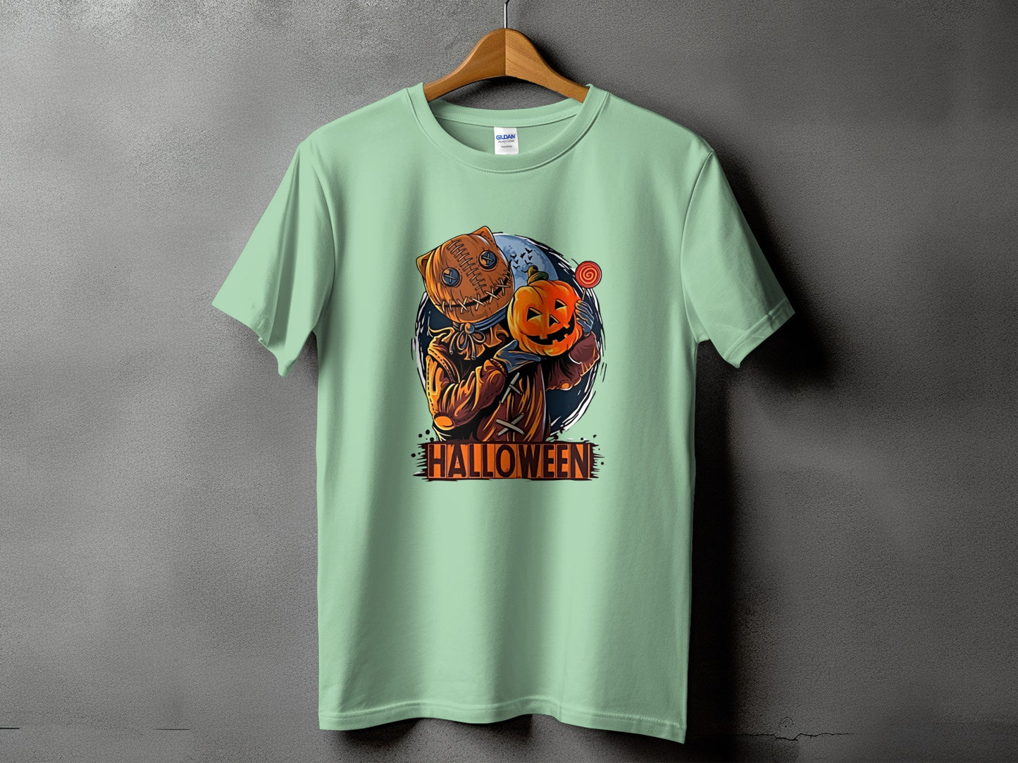 Light green t-shirt with graphic of character holding pumpkin and text "HALLOWEEN".