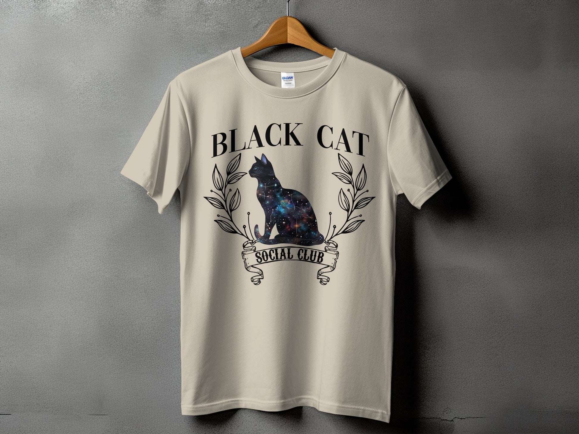 Light beige t-shirt with "BLACK CAT SOCIAL CLUB" text and galaxy cat graphic.