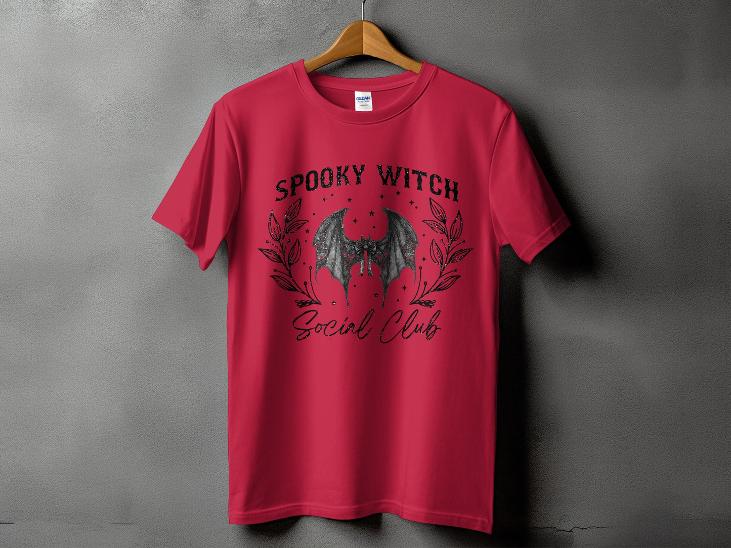 Red t-shirt with "Spooky Witch Social Club" text and bat graphic.