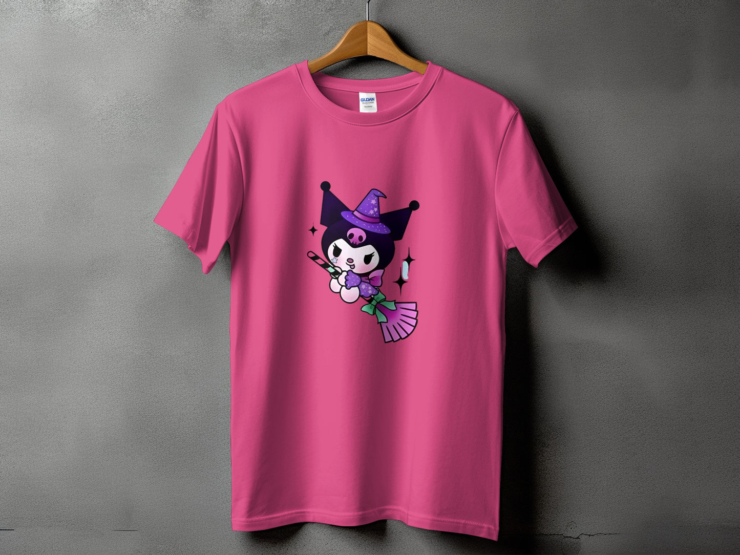 Pink t-shirt with Kuromi character holding a candy cane and broom.