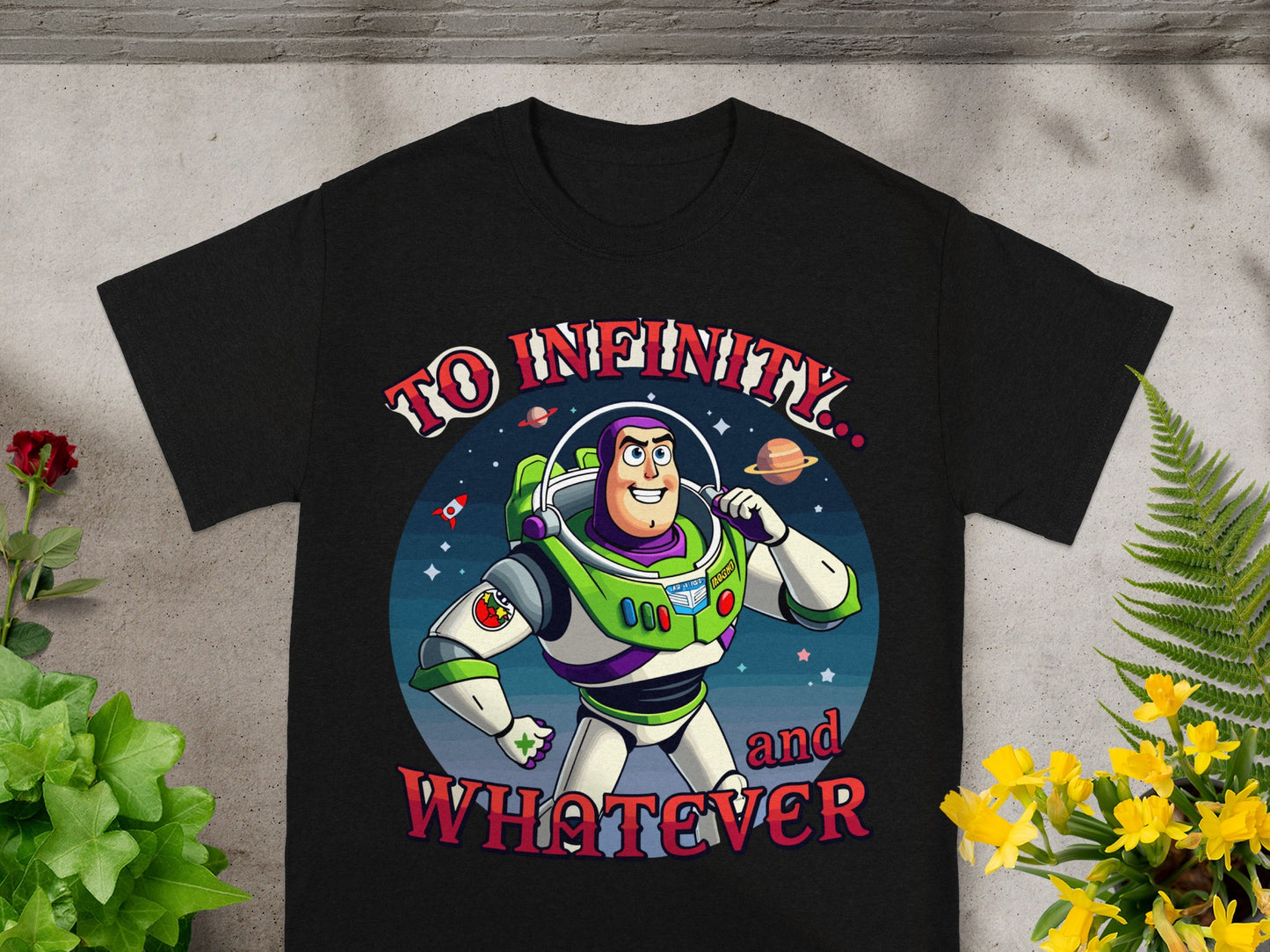 Black t-shirt with Buzz Lightyear graphic and text "TO INFINITY and WHATEVER".