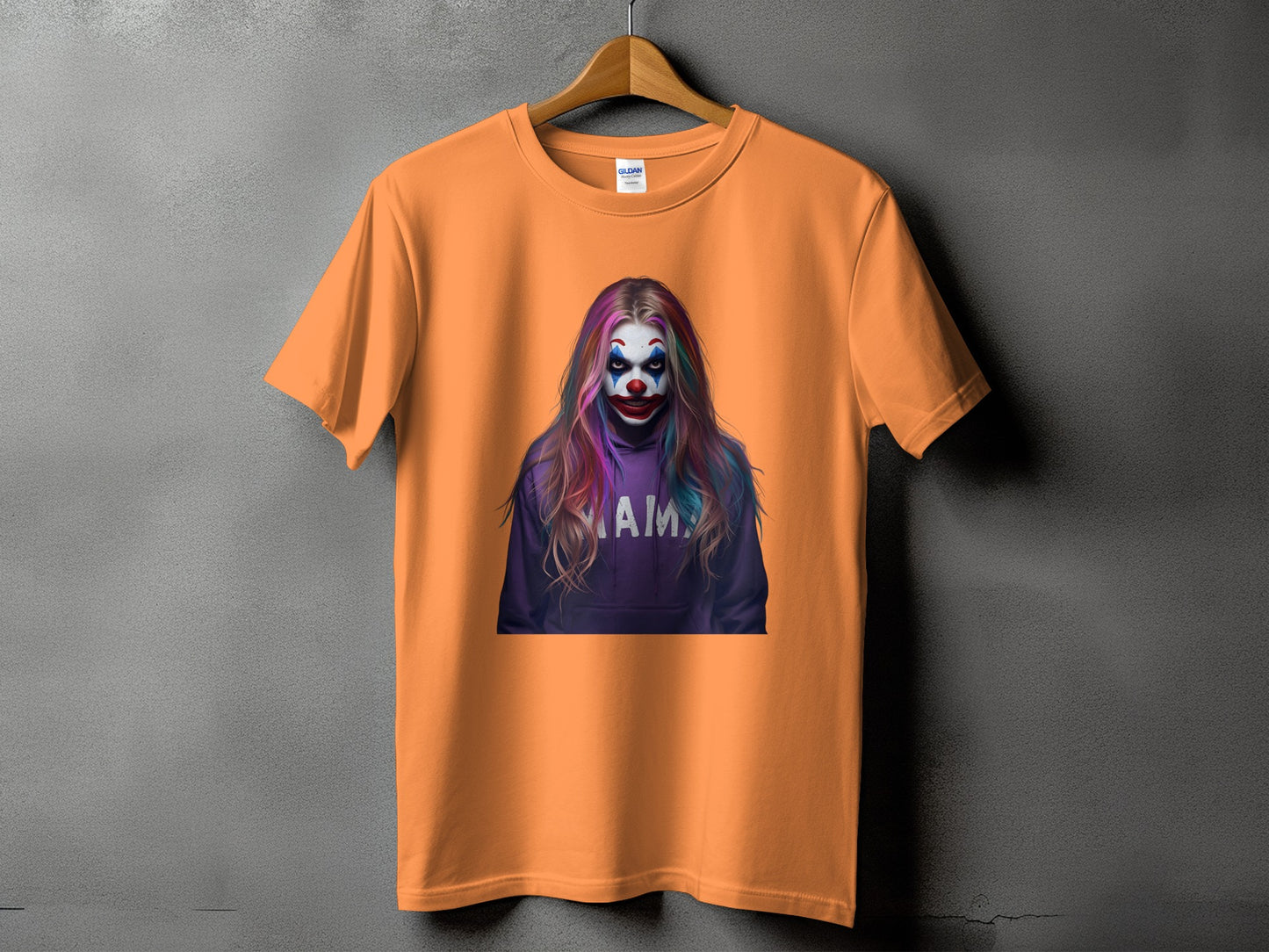 Orange t-shirt with graphic of a clown with colorful hair and "mama" text.