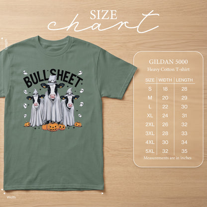 Green t-shirt with cows dressed as ghosts and pumpkins, "BULL SHEET" text. Includes size chart.
