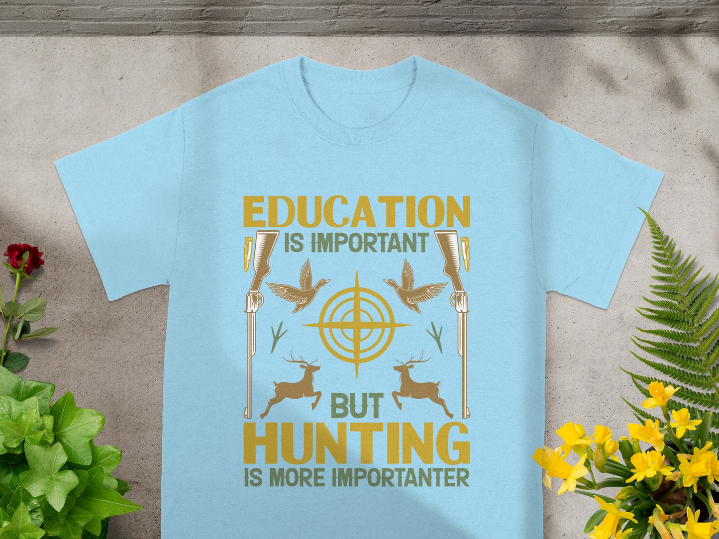 Light blue t-shirt with text "Education is Important but Hunting is More Importanter" and hunting graphics.