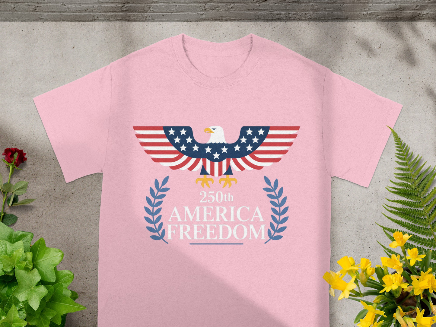 Pink t-shirt with American flag eagle and "250th Freedom" text.