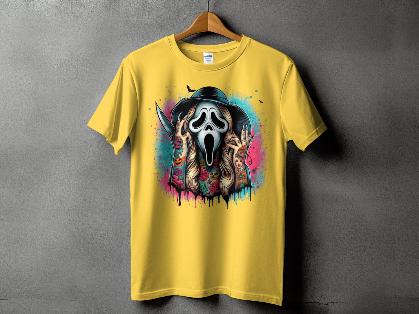 Yellow t-shirt with a ghost face mask, knife, bats, and colorful tattoos.