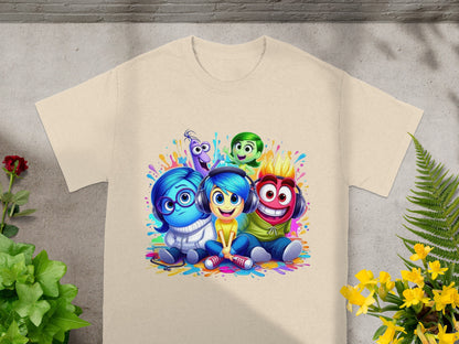 Disney Inside Out characters Joy, Sadness, Fear, Anger, and Disgust on a beige t-shirt.