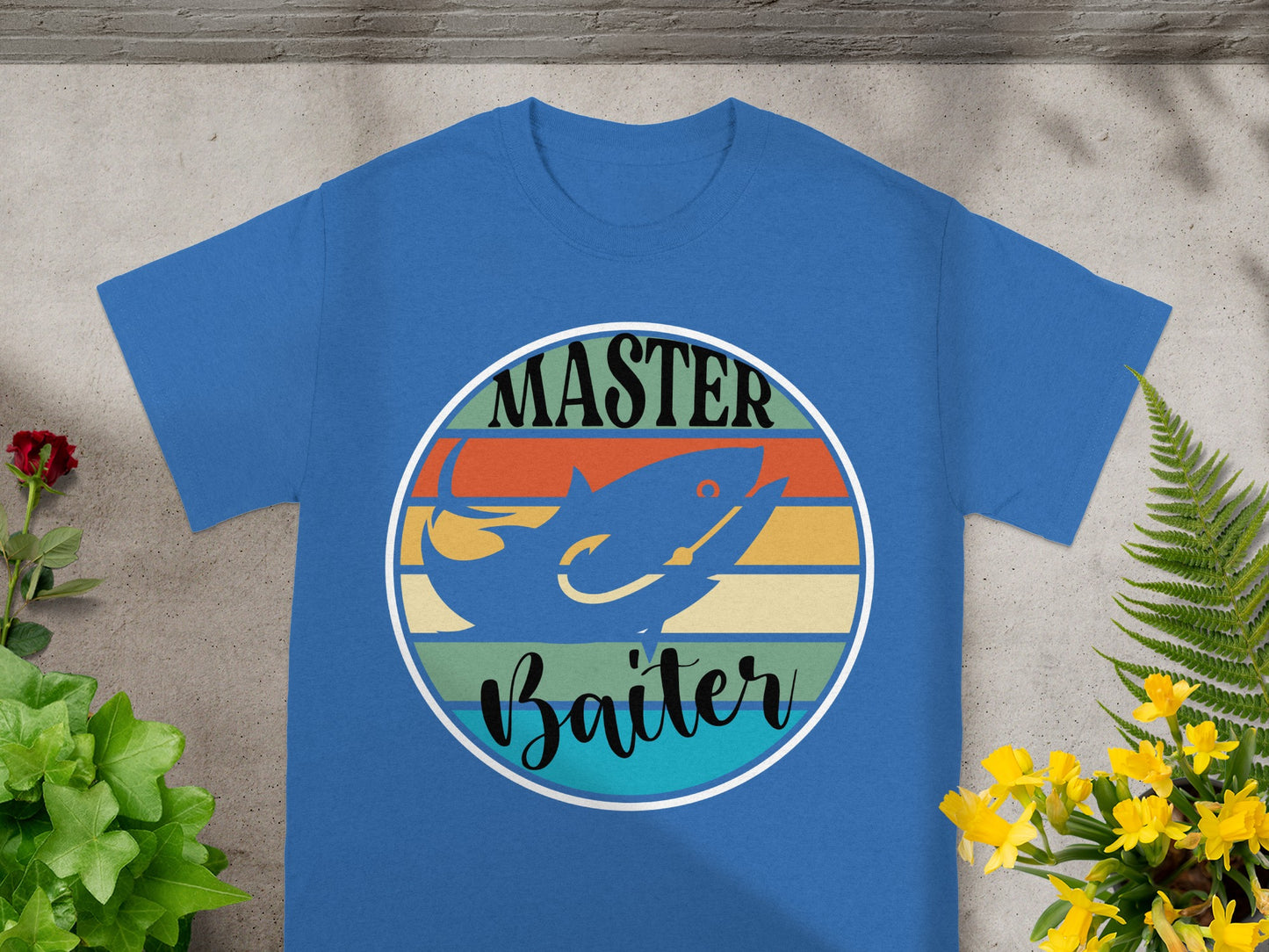 Blue t-shirt with a circular graphic featuring a shark and the text "Master Baiter".