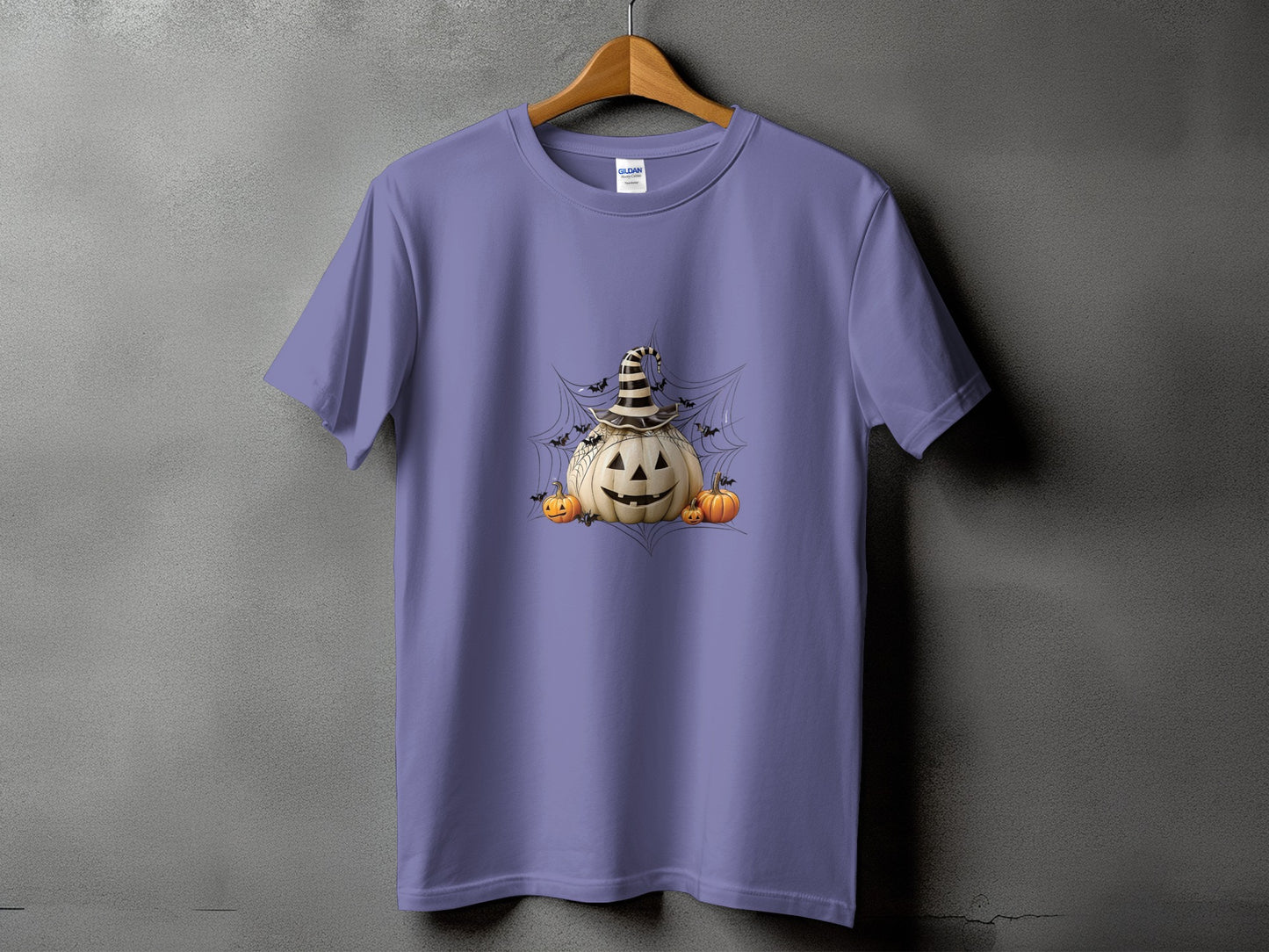 Purple t-shirt with a Halloween graphic of a jack-o'-lantern wearing a witch hat.
