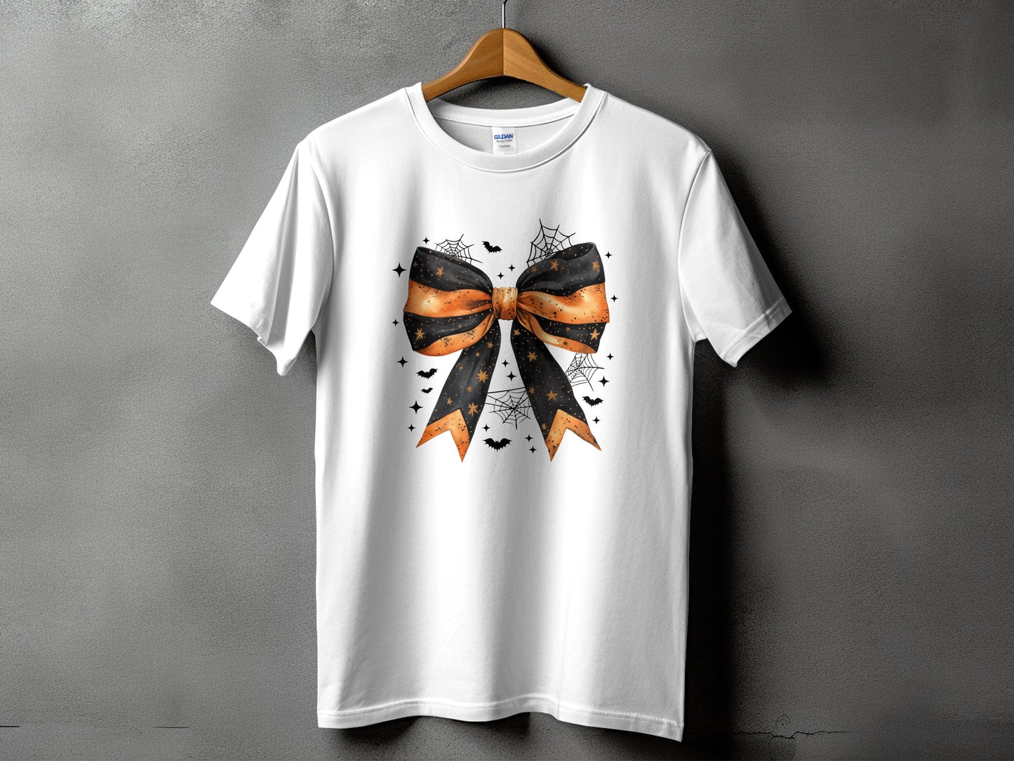 White t-shirt with a black and orange Halloween bow with bats and stars.