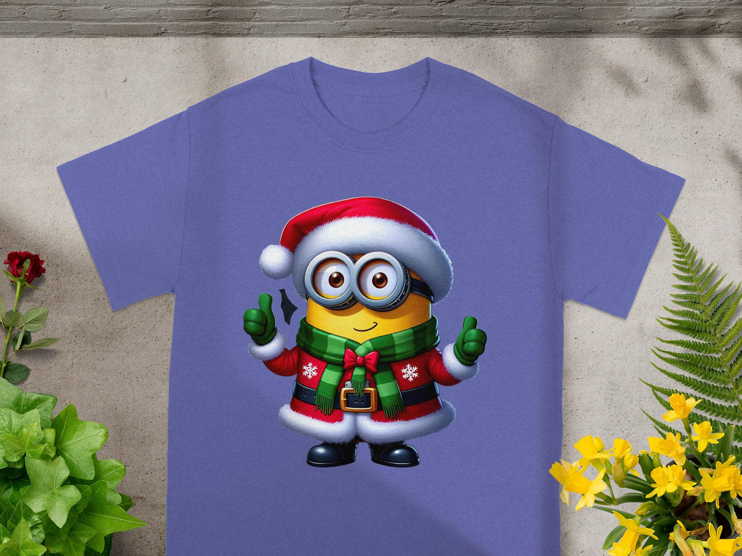 Minion character wearing a Santa hat, festive scarf, and coat, giving two thumbs up.