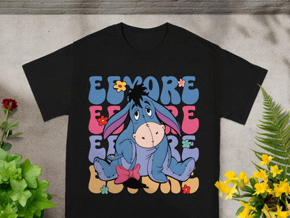 Black t-shirt with Eeyore graphic and colorful floral design.