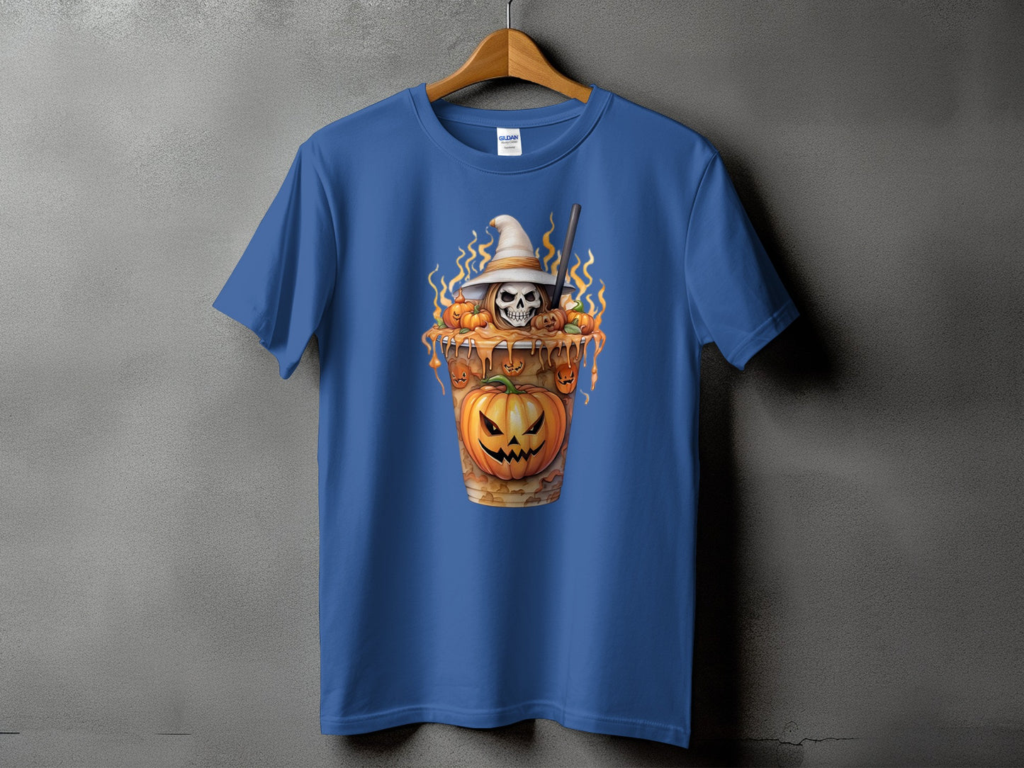 Blue t-shirt with a Halloween graphic of a skull in a witch hat and pumpkins.