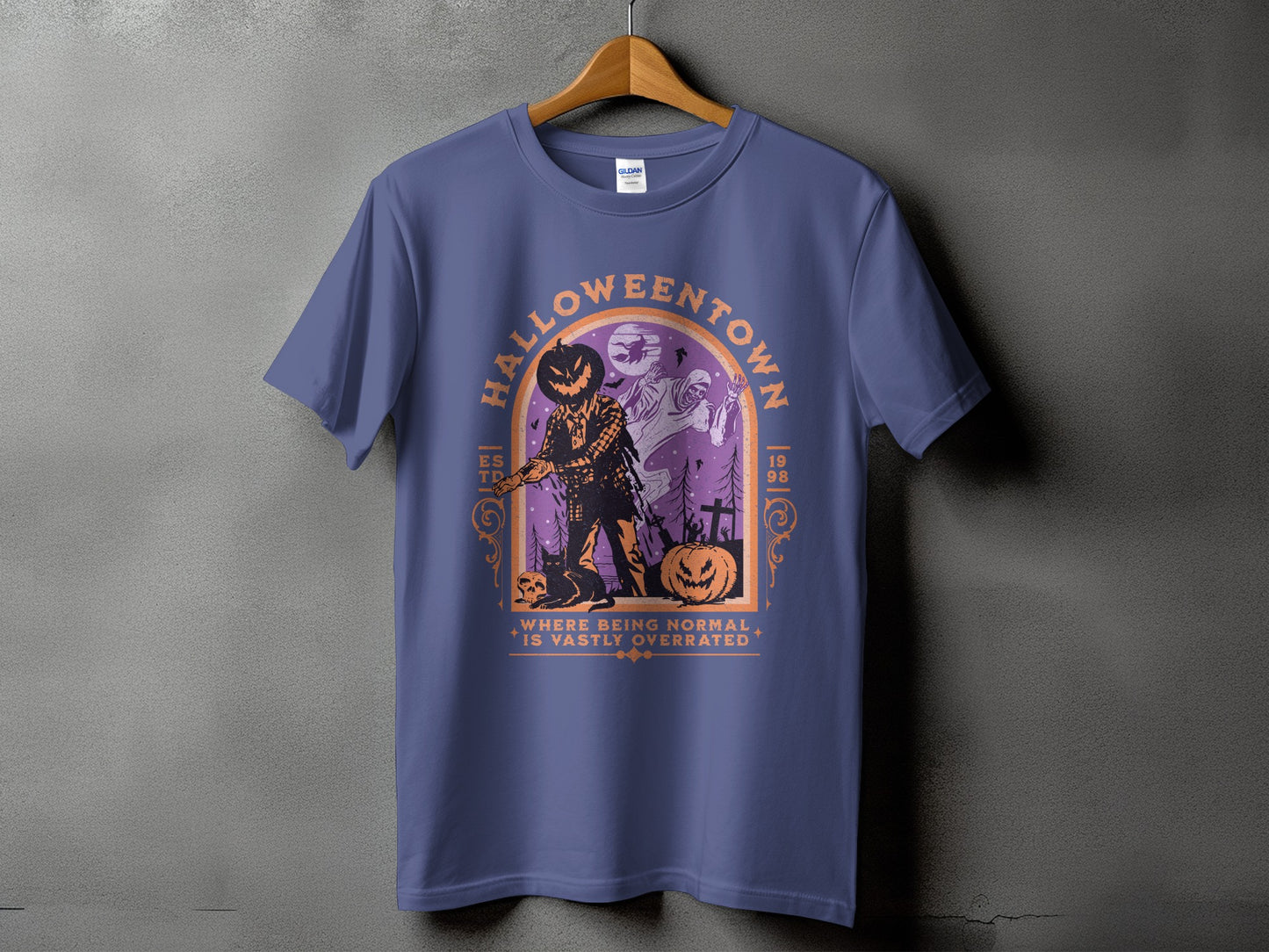 Halloween town graphic with scarecrow, pumpkin, ghost, and text.