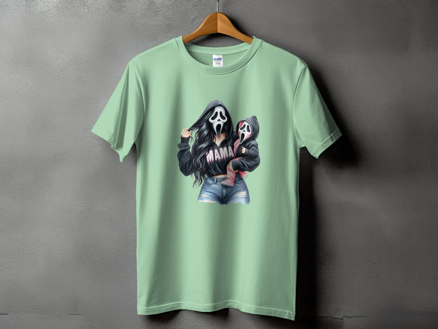 Ghostface mother and child graphic with "MAMA" text on a light green t-shirt.