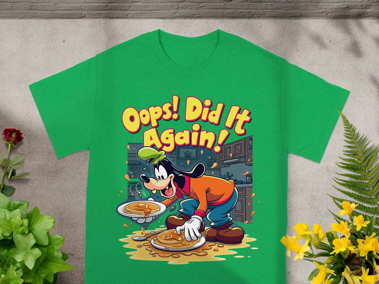 Goofy holding a plate of pancakes with the text "Oops! Did It Again!".