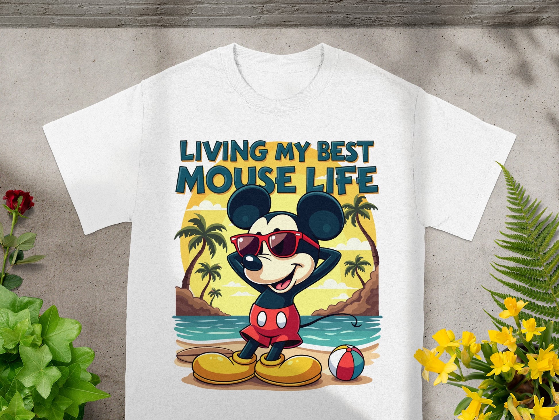 White t-shirt with Mickey Mouse on a beach, text reads "Living My Best Mouse Life."