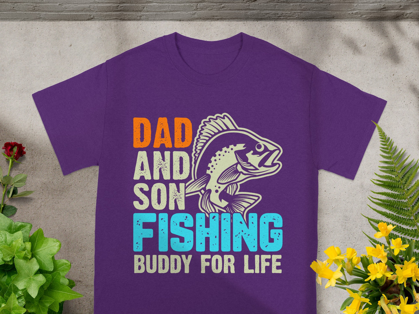 Purple t-shirt with "Dad and Son Fishing Buddy for Life" text and fish graphic.