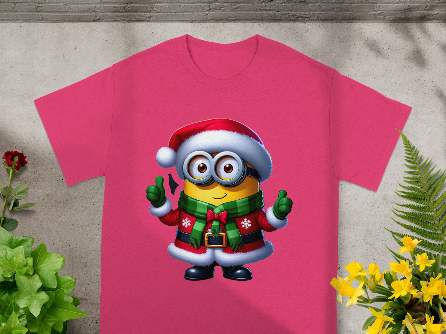 Pink t-shirt with a Minion wearing a Santa hat and a festive scarf.
