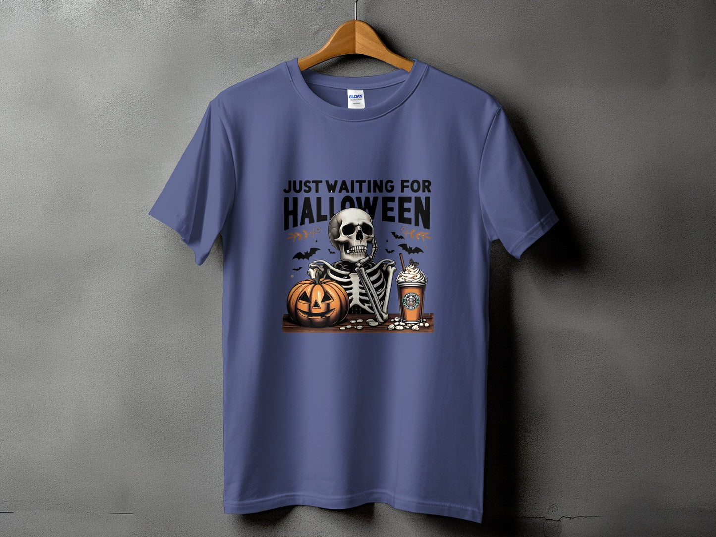 Skeleton, pumpkin, and coffee cup graphic with text "Just Waiting for Halloween".